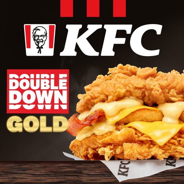 Grafika przedstawia burgera podwójny kurczak w wersji Double Down Gold z sosem Kentucky Gold w KFC.