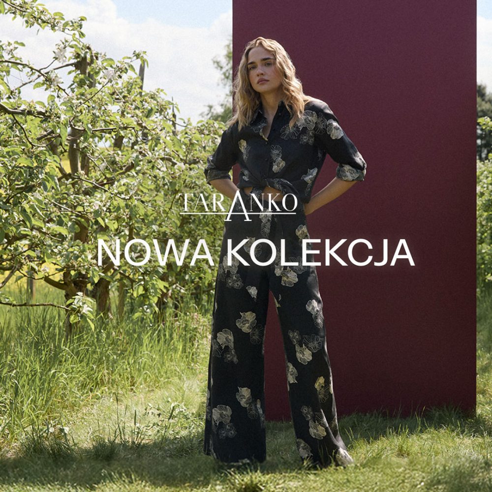 Zdjęcie wizerunkowe marki Taranko przedstawia modelkę w eleganckim, ciemnym kombinezonie w jasny, kwiatowy wzór, stojącą w ogrodzie na tle zielonych drzew i bordowego panelu. Na środku grafiki umieszczono duże, białe napisy z logo „TARANKO” oraz hasłem „NOWA KOLEKCJA”.